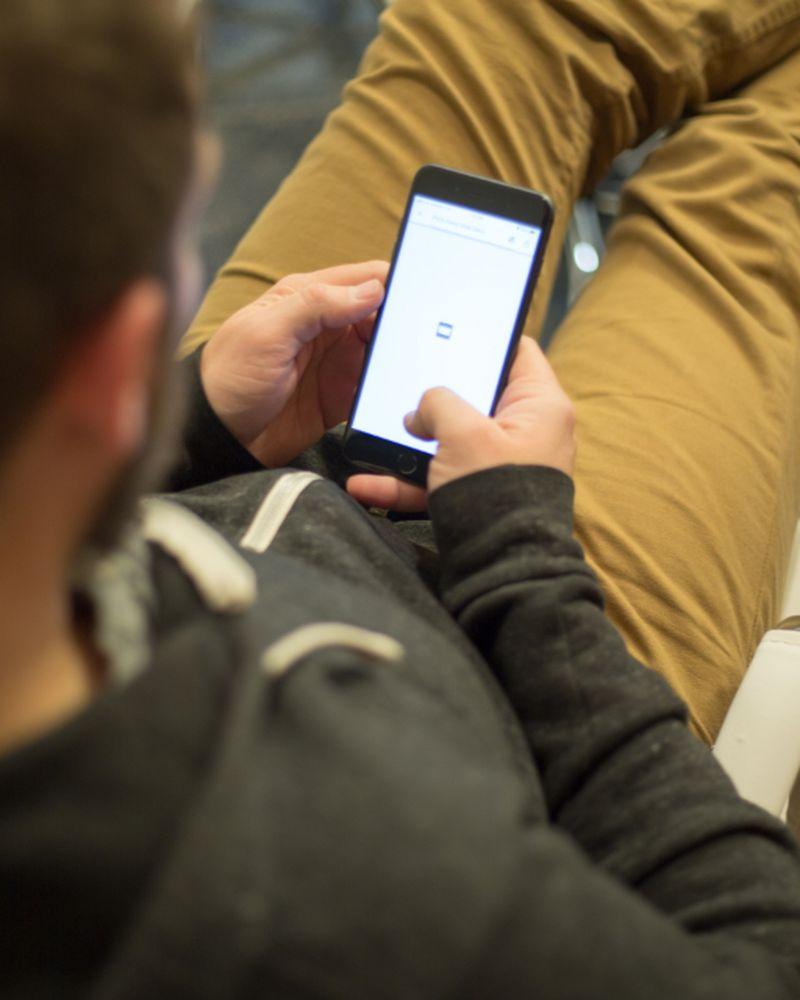Person photographing an item with their phone to create a listing